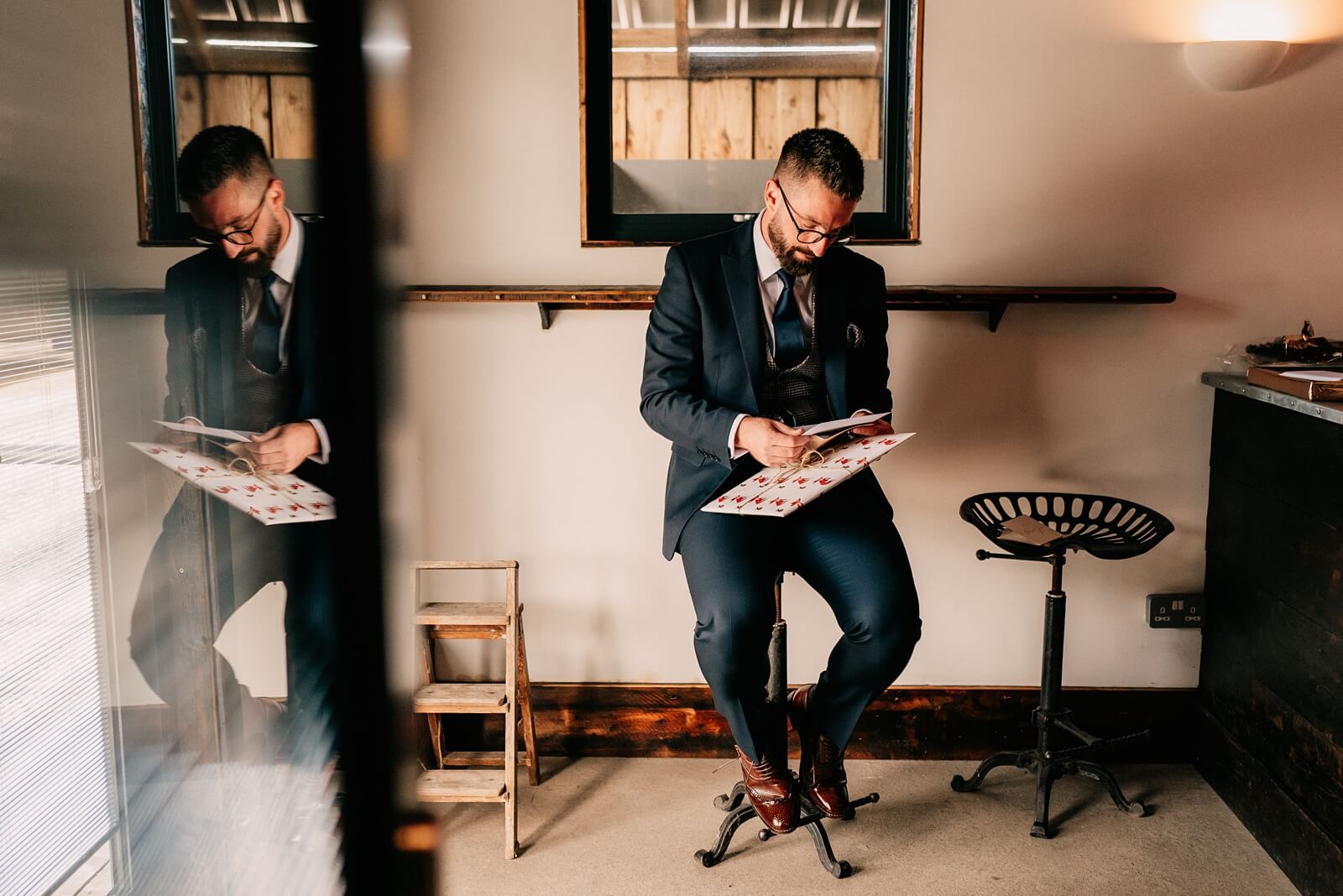 The groom opening gifts