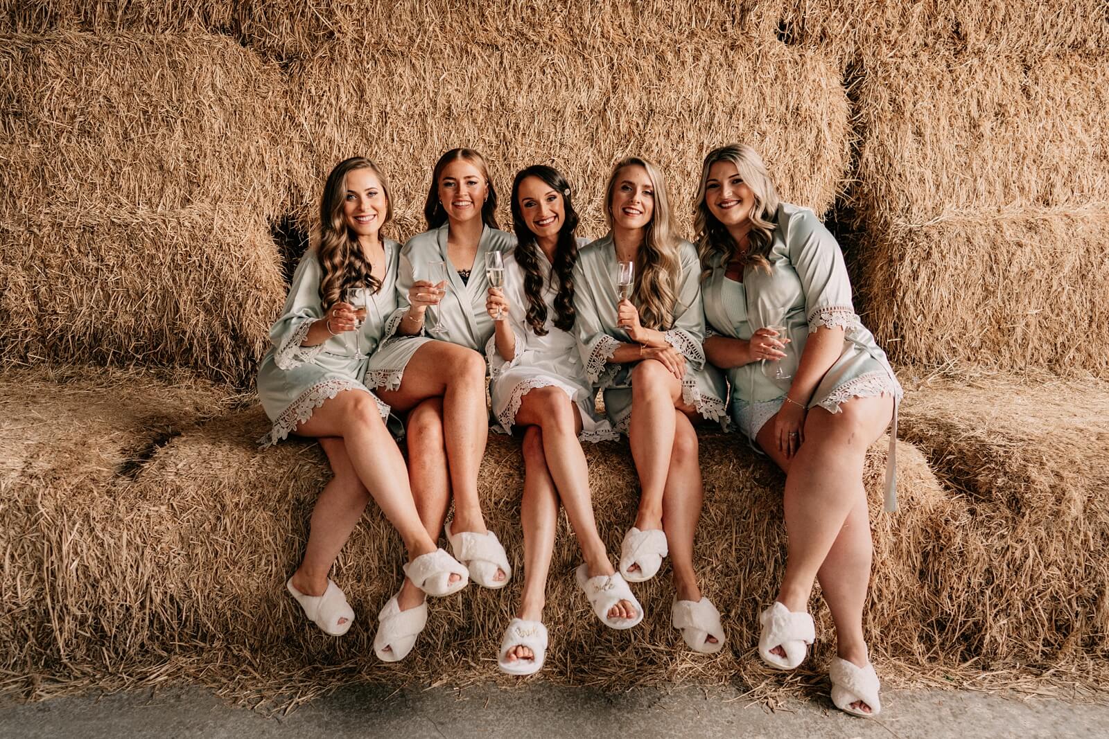 Bridesmaids and bride in matching silk dressing gowns.