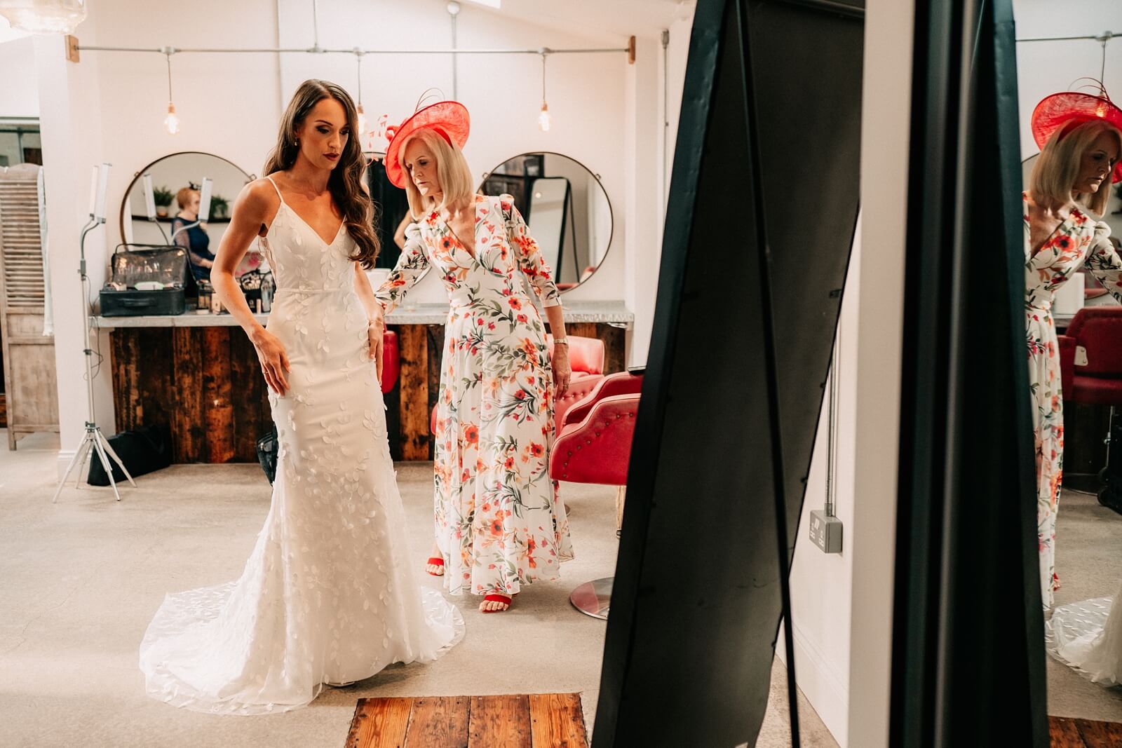 Bride getting into her petal detail dress