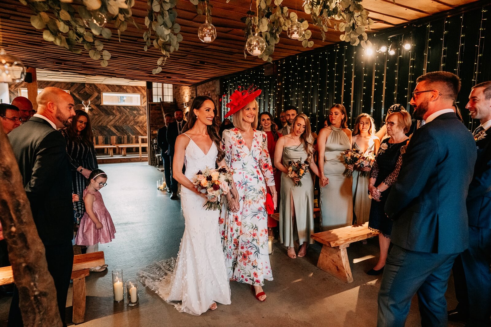 Bride walking down the aisle at Owen House Wedding Barn