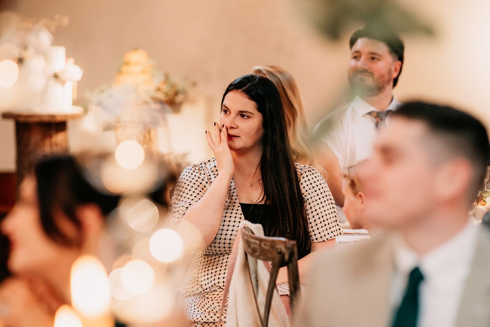 Guests watching the wedding speeches