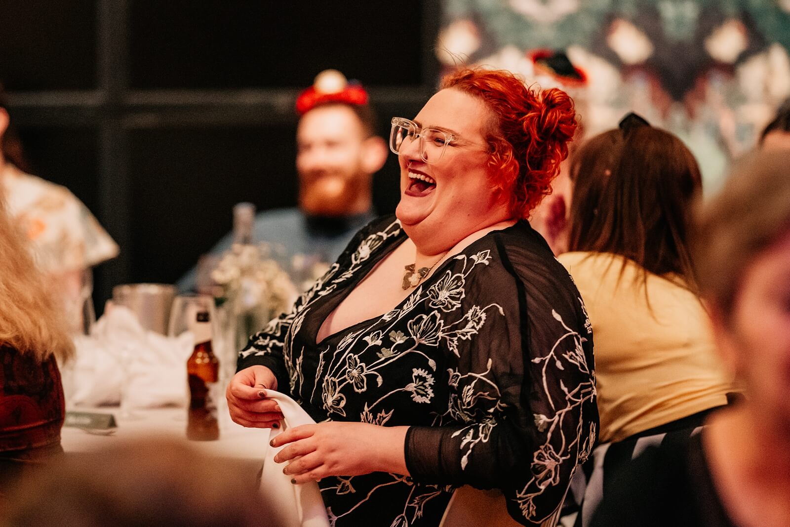 Guests laughing during speeches