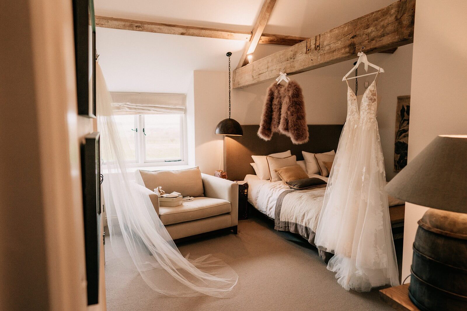 Stone barn wedding with Watters dress