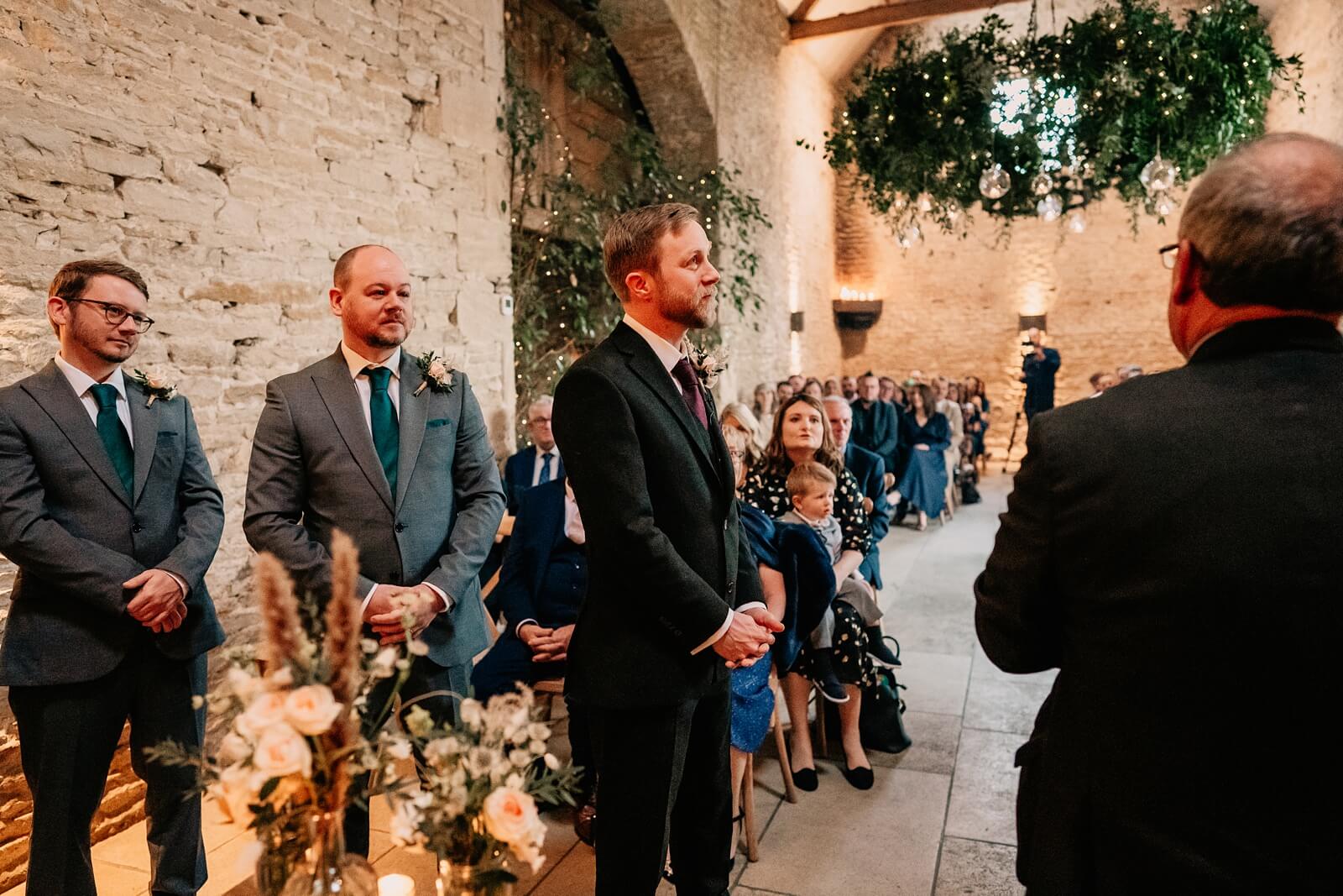 Groom waiting during the ceremony