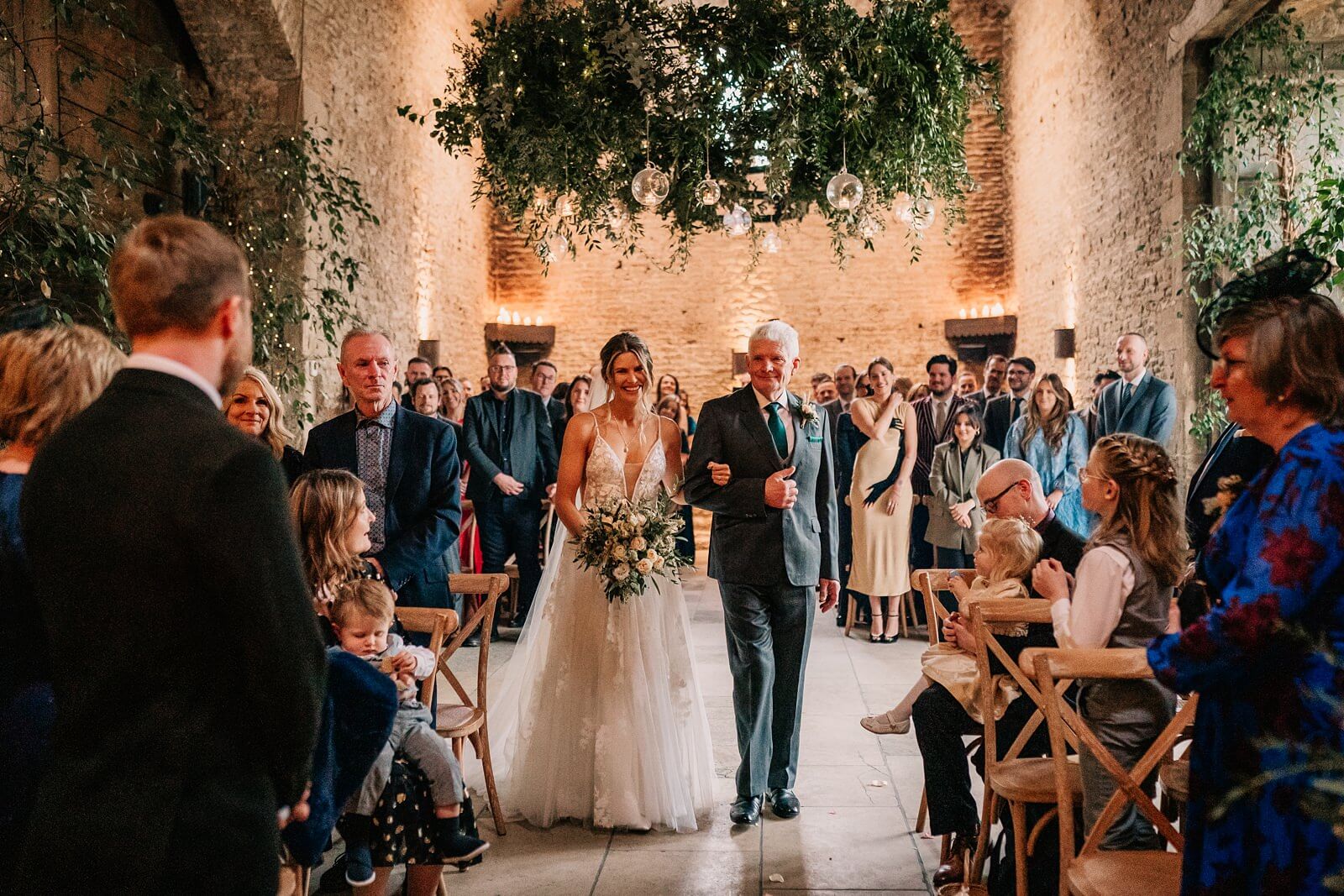 Bride walking down the aisle at Stone Barn