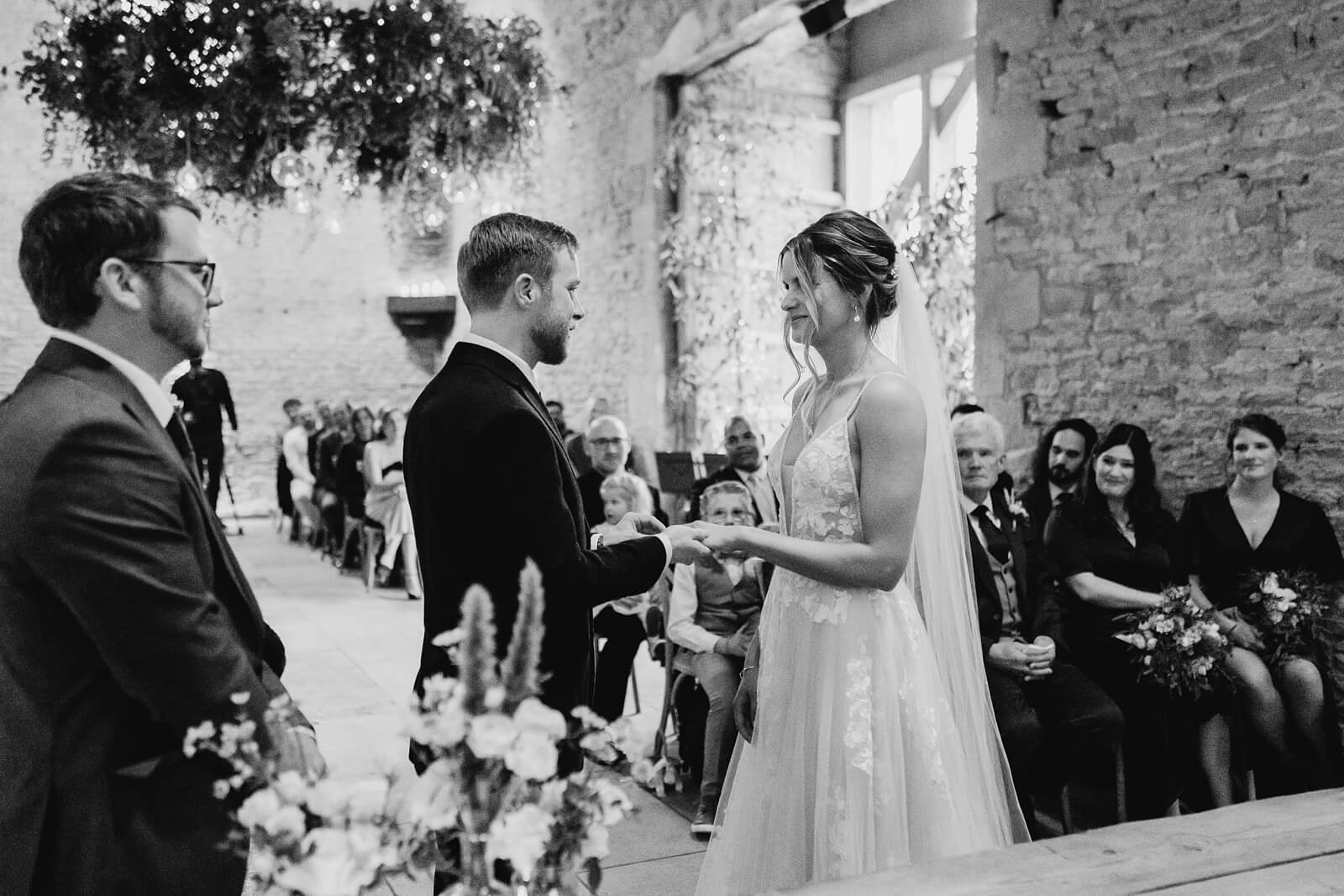 Exchanging rings at Stone Barn ceremony