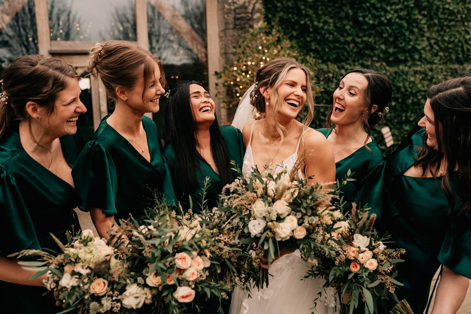 Bridesmaids and bride laughing portrait