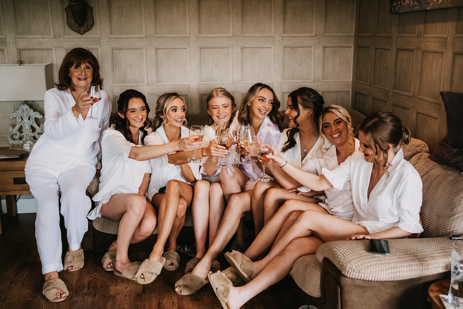 Bride with her bridesmaids toasting