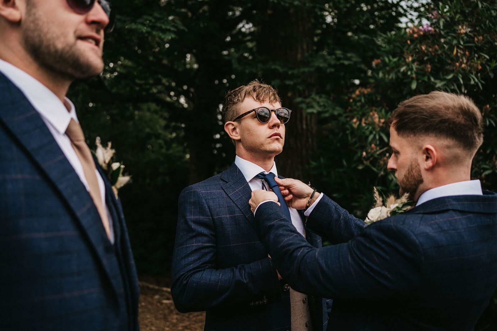 Groom in a navy suit and tie