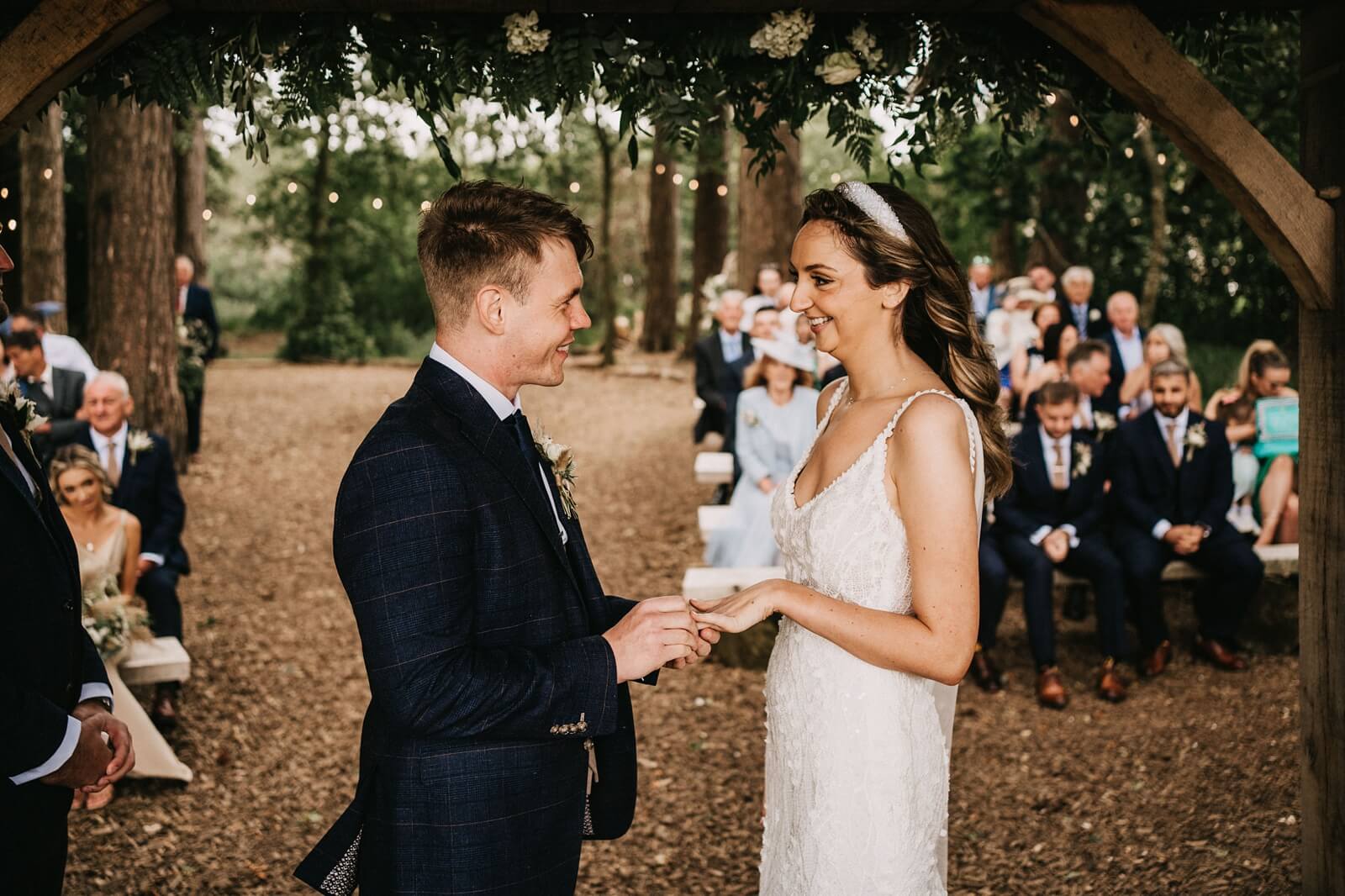 Exchanging rings at the woodland ceremony